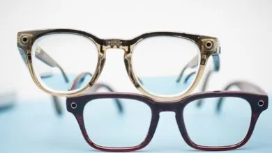 Two pairs of Ray-Ban Meta Gen 2 smart glasses stacked on a light blue and white surface.