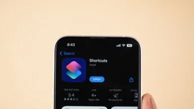 Close-up of a smartphone screen displaying the Apple Shortcuts app page in the App Store.