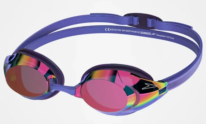 Speedo Vanquisher 3.0 swim goggles with purple straps and iridescent pink mirrored lenses.