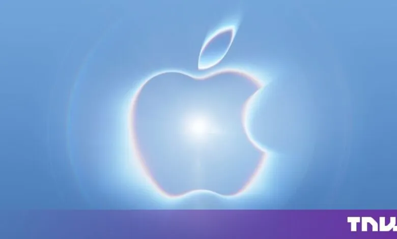 Glowing Apple logo centered against a bright blue background with circular light refractions.