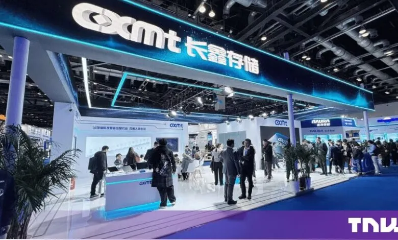 CXMT exhibition booth with glowing blue signage and visitors exploring the technology showcase