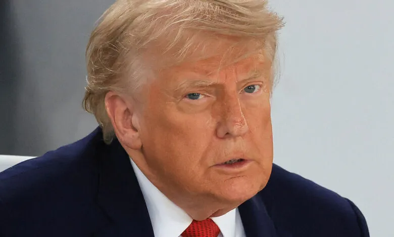 Close-up portrait of US President Donald Trump looking thoughtfully during a meeting.