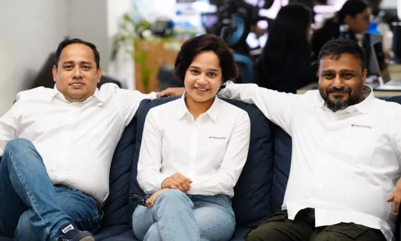 Three Hoomanely executives, Harshal Hinger, Sai Supriya Sharath, and Vipin Ravindran, sitting on a sofa.