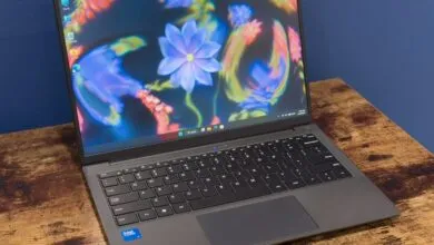 Sleek gray laptop displaying a vibrant floral wallpaper on its screen
