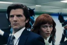 Actor Adam Scott and another person in a scene from the TV show Severance