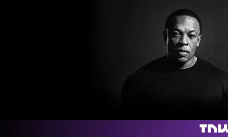 Black and white portrait of music producer and rapper Dr. Dre against a dark background