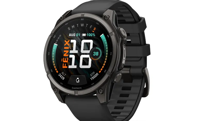 Black Garmin Fenix multisport GPS smartwatch with textured silicone band against white background.