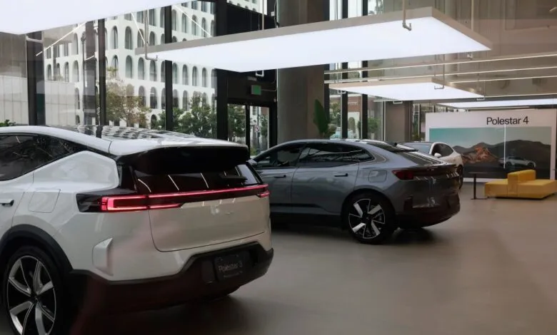 Modern Polestar showroom featuring sleek white and grey electric SUVs under bright lighting