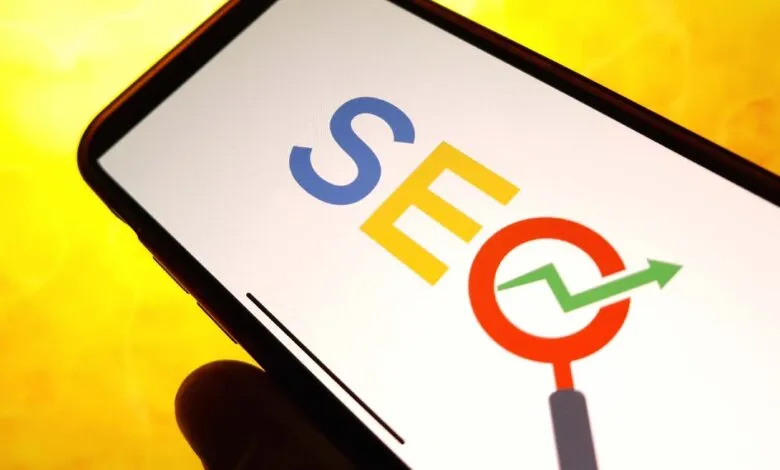 A smartphone displays the word SEO with Google brand colors and an upward trending green arrow.
