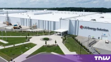 Aerial view of the large LG Energy Solution manufacturing facility with a white roof and landscaped entrance.