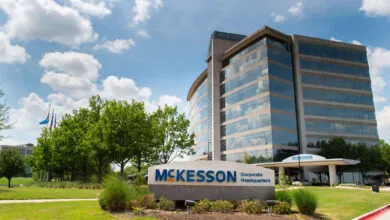 McKesson Corporate Headquarters building featuring large glass windows under a blue sky.
