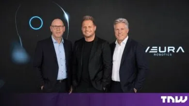 Three Neura Robotics executives posing against a dark branded backdrop