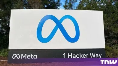 Large Meta corporate sign displaying the blue infinity logo and 1 Hacker Way address.