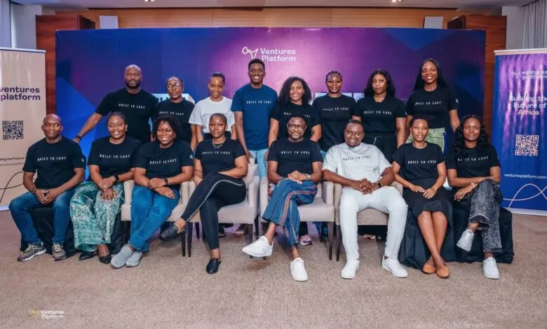 Group portrait of the Ventures Platform team posing together in matching black t-shirts.