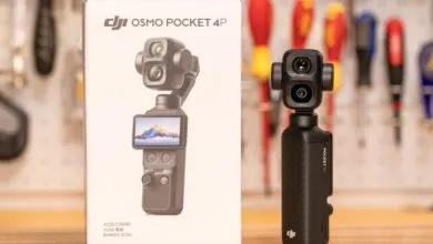 DJI Osmo Pocket 4P camera standing upright next to its white retail packaging box.