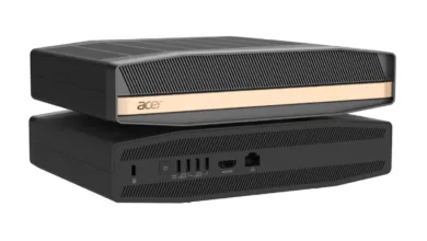 Two black and gold Acer compact mini PCs stacked on top of a white background.