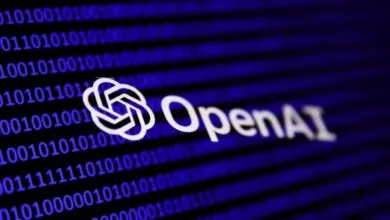 OpenAI logo displayed over a glowing blue background of binary code.