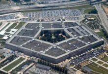 High-altitude aerial view of the Pentagon building and surrounding highway infrastructure.