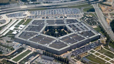 High-altitude aerial view of the Pentagon building and surrounding highway infrastructure.