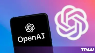 Smartphone displaying the OpenAI logo against a vibrant blue and pink gradient background.