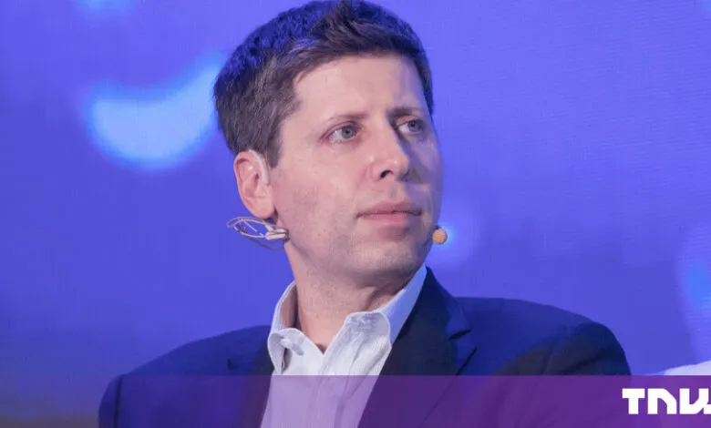 OpenAI CEO Sam Altman wearing a dark suit and white shirt against a blue background.