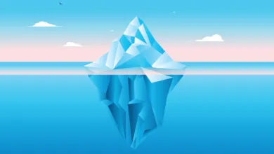 Digital illustration of a geometric low-poly iceberg floating in bright blue ocean water.