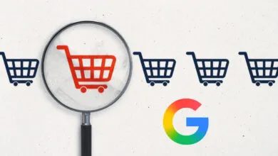 A magnifying glass highlighting a red shopping cart among blue carts beside a Google logo.