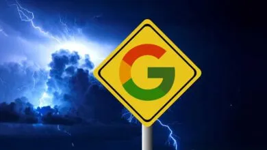 A yellow diamond-shaped sign with the Google logo against a dark stormy sky with lightning.