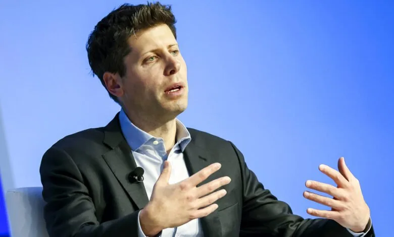 Sam Altman, CEO of OpenAI, speaks passionately, gesturing with his hands against a bright blue background.