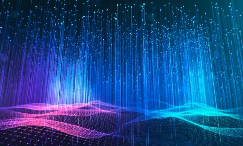 Abstract digital art depicting glowing blue and pink lines forming a wave-like pattern against a dark background.