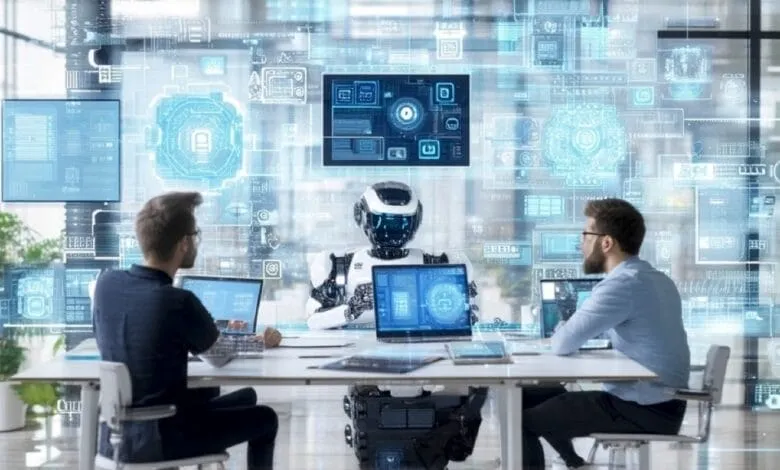 Two men work at laptops alongside a robot, all situated before a large screen displaying complex digital schematics.