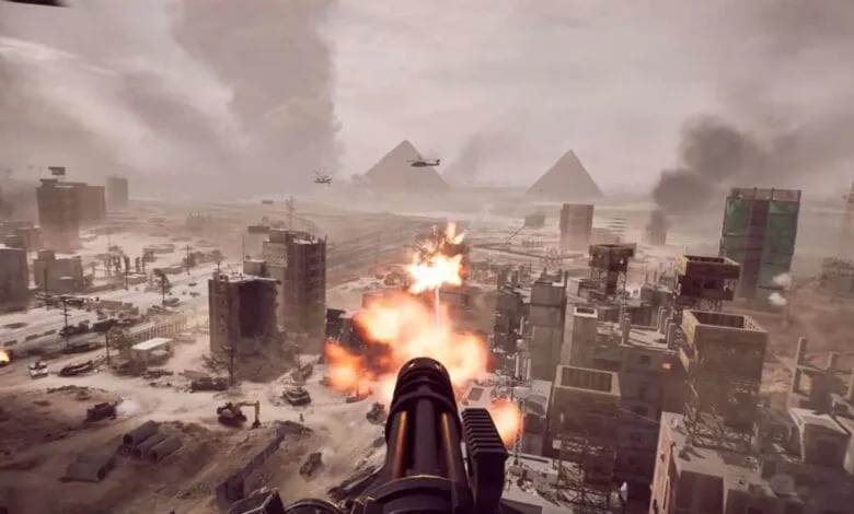 Battlefield 6 gameplay: A first-person view of a player firing a large-caliber weapon at a war-torn city with pyramids in the background.