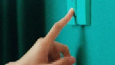 Pixelated hand reaches to flip a teal light switch against a dark teal wall.