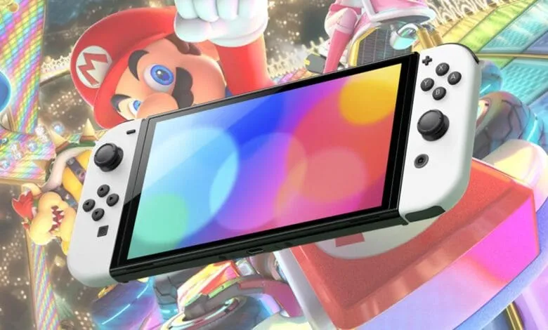Nintendo Switch OLED model displayed against a vibrant Mario Kart background featuring Mario and Bowser.