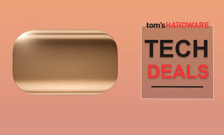 Gold-colored tech gadget case on peach background with Tom's Hardware Tech Deals graphic.