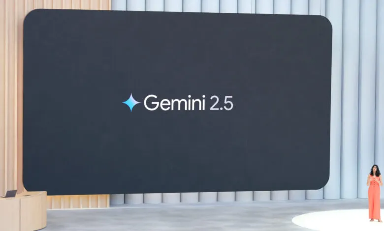 Google Gemini 2.5 announcement at a tech event. A woman in coral presents on a large screen.