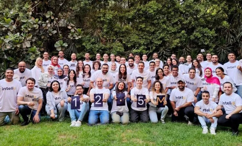 Intella team celebrates 1.25 million milestone with a large group photo outdoors.
