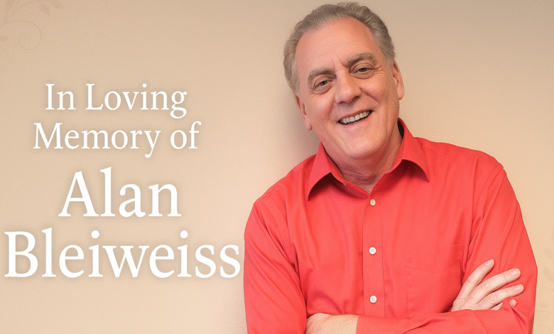 Smiling man in a red shirt with text 'In Loving Memory of Alan Bleiwess'.