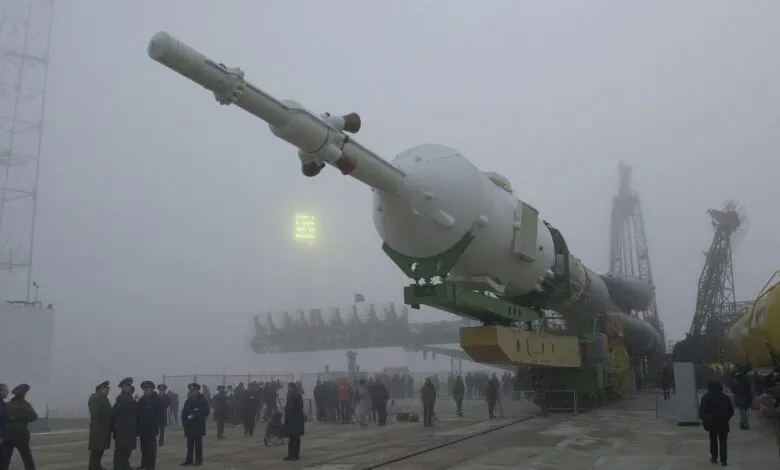 Soyuz rocket being transported to the launch pad on a foggy day at Baikonur Cosmodrome.