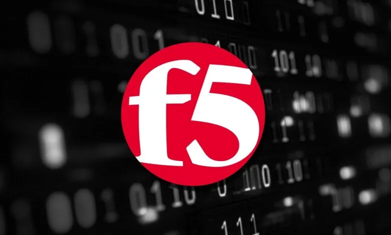 F5 Networks logo in white on a red circle against a blurred background of binary code.