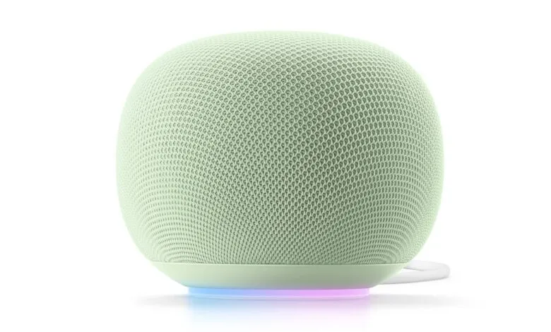 A light green smart speaker with a subtle light ring at its base.