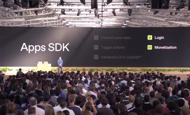 A speaker presents 'Apps SDK' features including Login and Monetization to a large audience.