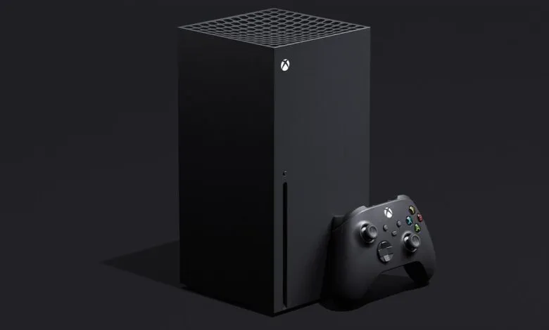 Black Xbox Series X console and controller on a dark background.