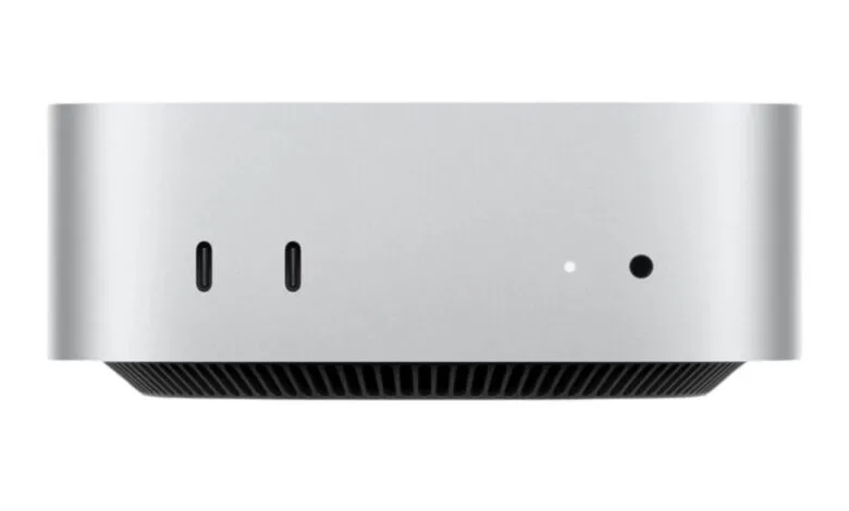 Close-up of the side of a silver Apple Mac Studio computer, showing two USB-C ports and indicator lights.
