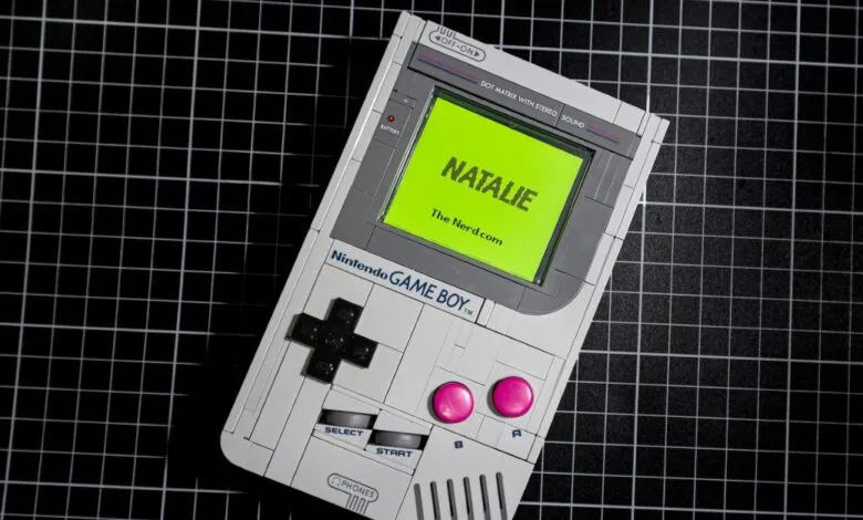 A custom Nintendo Game Boy with a bright green screen displaying 'NATALIE The Nerd.com'.