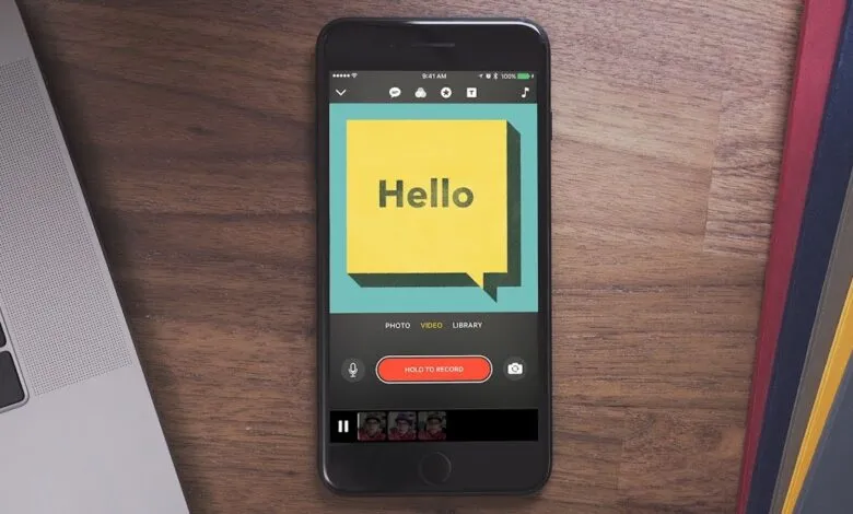 iPhone screen displaying a video recording app with a 'Hello' message.
