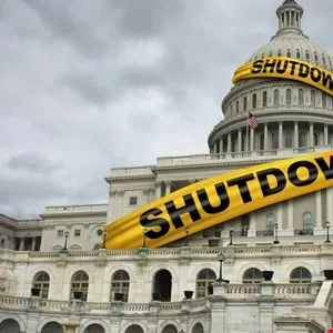 The U.S. Capitol building is wrapped in yellow 'SHUTDOWN' tape.
