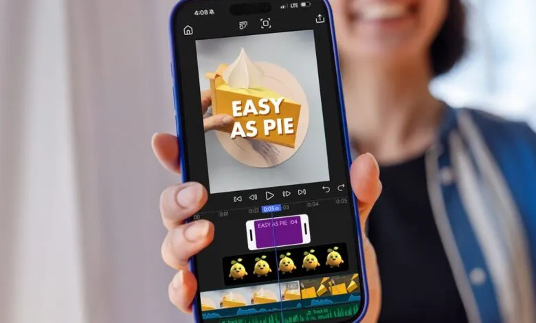 Person holding a smartphone displaying a video editing app with a pie graphic.