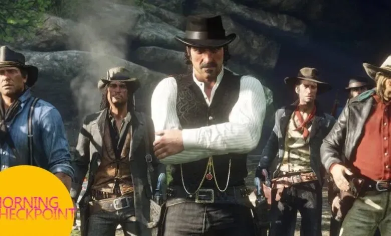 A group of cowboys stand together, looking determined.