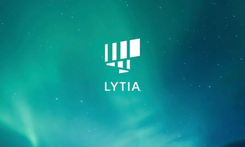 Lytia logo over a vibrant aurora borealis background with stars.
